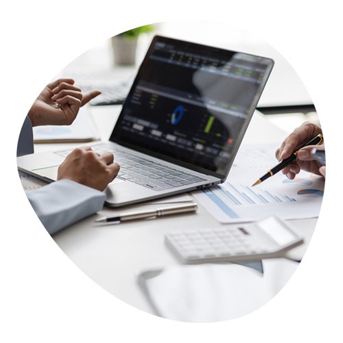 Students examining graphs on PC in office/study room