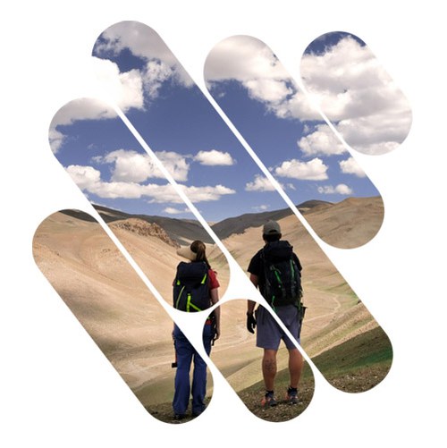 A boy and a girl exploring in a territory boundless in nature, between desert and green areas