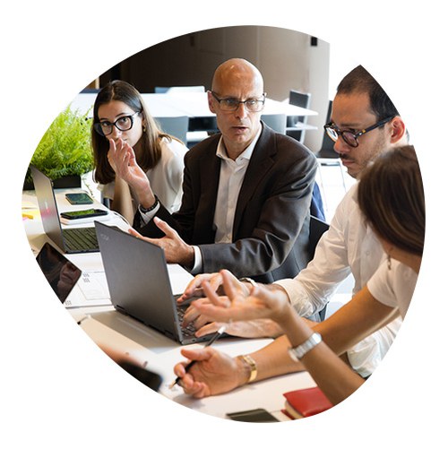 Group of students and teachers working together