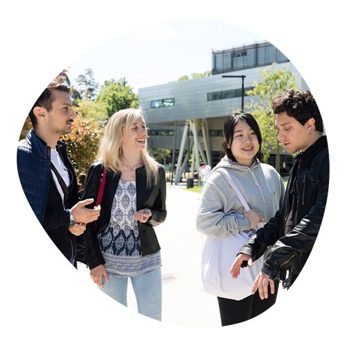 Group of students talking in the courtyard of the university