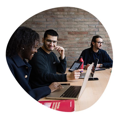 Group of international students discussing and studying together