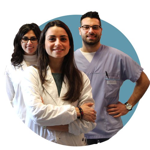 Group of students wearing lab coat posing for a photo