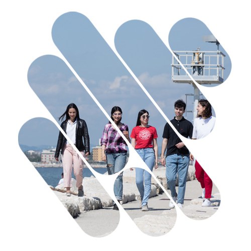 Group of students walking on the seafront in Rimini