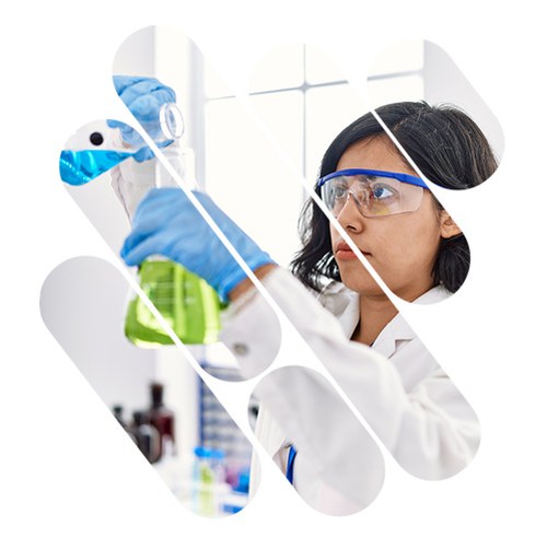 Una studentessa in laboratorio chimico che lavora con una provetta e un dosatore